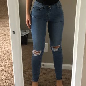 Medium blue wash high rise stretch denim jeans